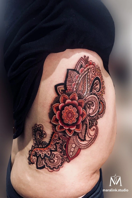 Red & black floral mandala — body tattoo by Maral at Maralink Studio, Richmond Hill